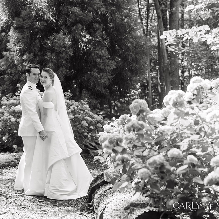 Couple posing in gardens for wedding at Hidden View Farm in Annapolis, Maryland. Photo taken by Carley Fuller.