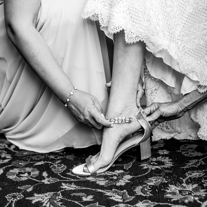 Bride putting on a shoe for a wedding at Hidden View Farm in Annapolis, Maryland.