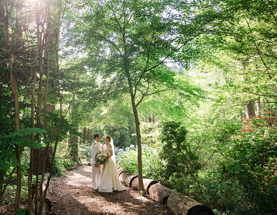 Bride and Groom in the Garden at Hidden View Farm in Annapolis, Maryland. Photo taken by Carley Fuller.